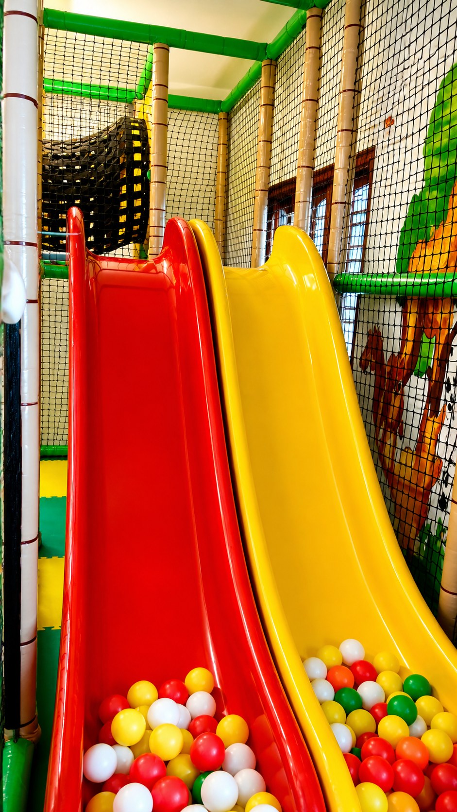 Indoor space-themed play zone with astronaut mural at Navashiksha HSR Layout