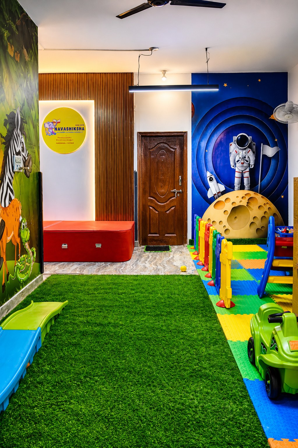 Slides and ball pit in the indoor play zone at Navashiksha HSR Layout
